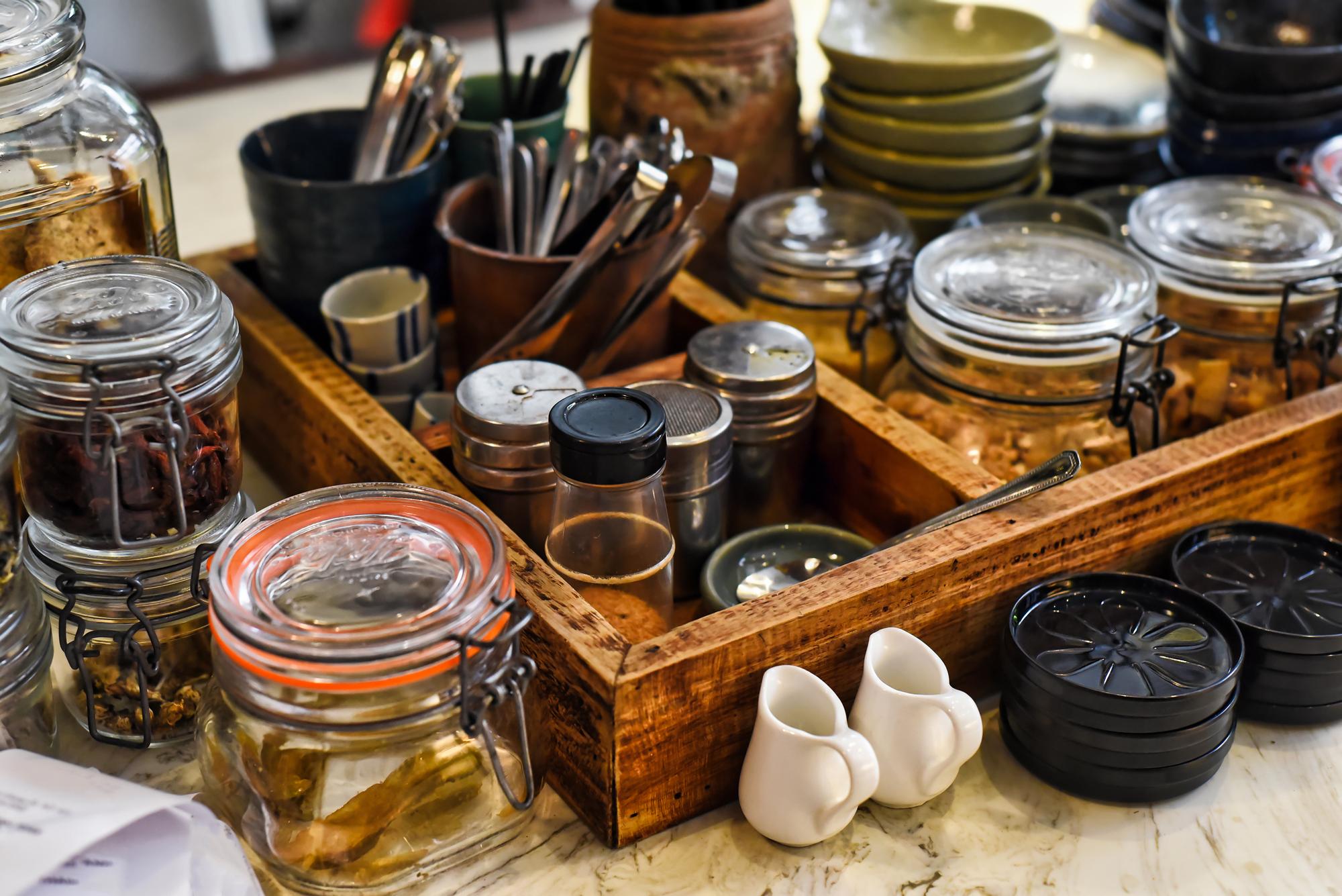 workbench with jars of spices and neatly labeled notes